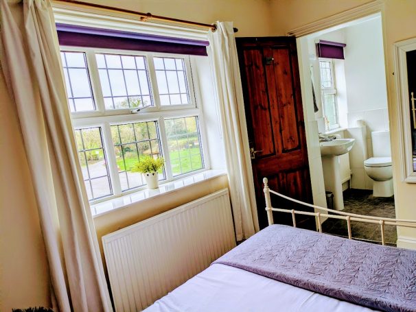 Large room with double bed and attached bathroom. Leaded window overlooking views of Canal Wharf.